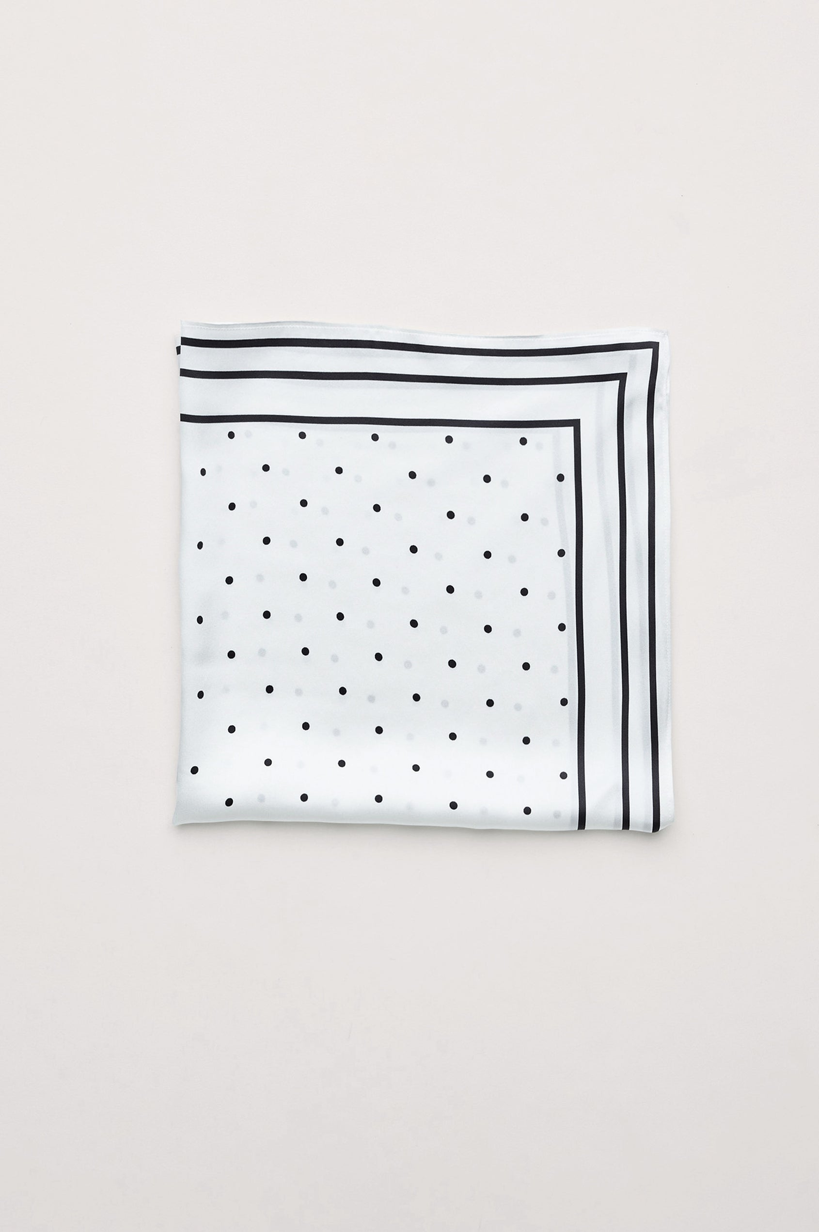 Finna Square Scarf in 100% Silk With Contrast Polka Dots and Striped Outline in White Colorway - Folded Flat Lay View Featured
