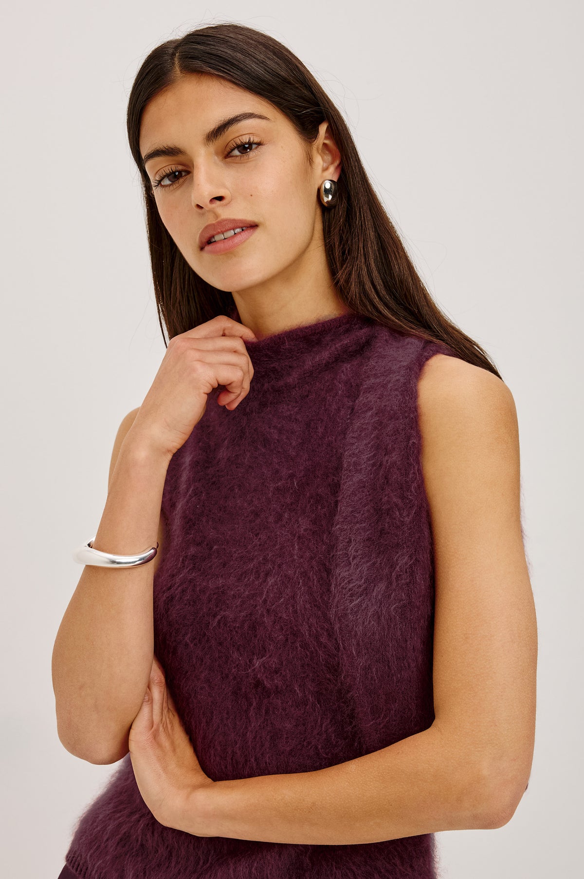 Flora Top in Brushed Knit With Mock Neck, Tie Detail, and Sleeveless Silhouette in Wine Colorway - Upper Body Front Detail View Featured on Model.