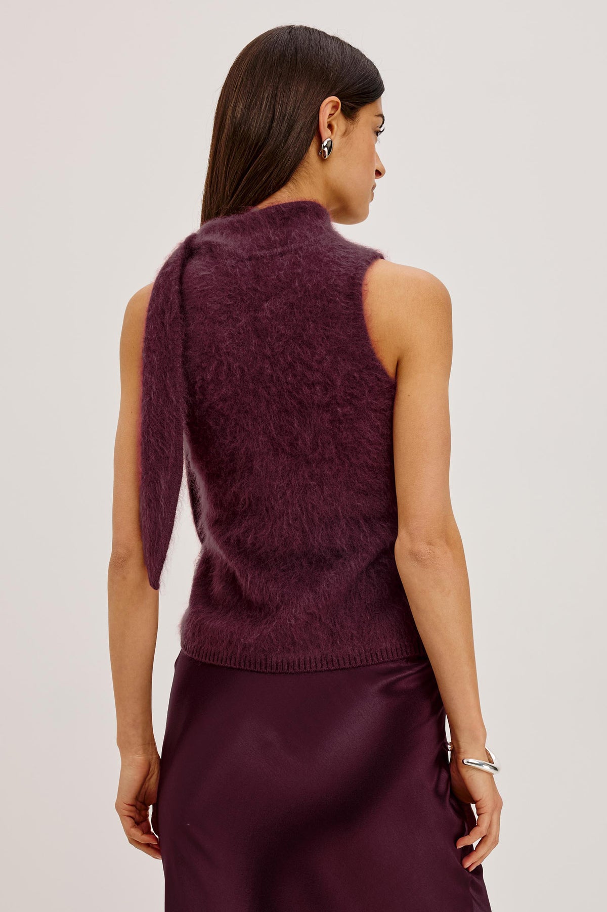 Flora Top in Brushed Knit With Mock Neck, Tie Detail, and Sleeveless Silhouette in Wine Colorway - Upper Body Back View Featured on Model.