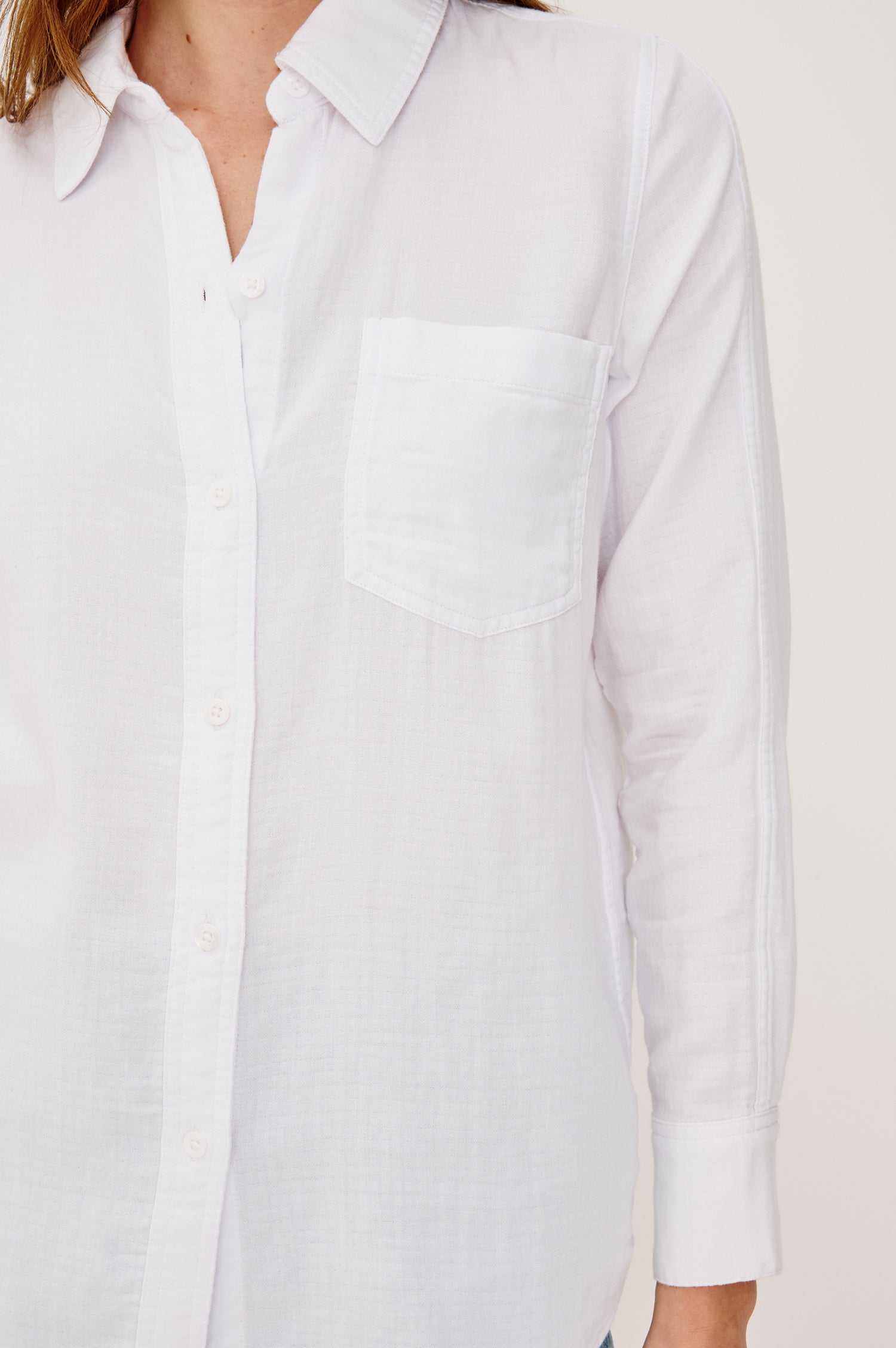 Freeman Button-Up Collared Shirt With Subtle Herringbone Texture Relaxed FIt Chest Patch Pockets and Long Sleeves in White Colorway - Upper Body Close Up View Featured on Model