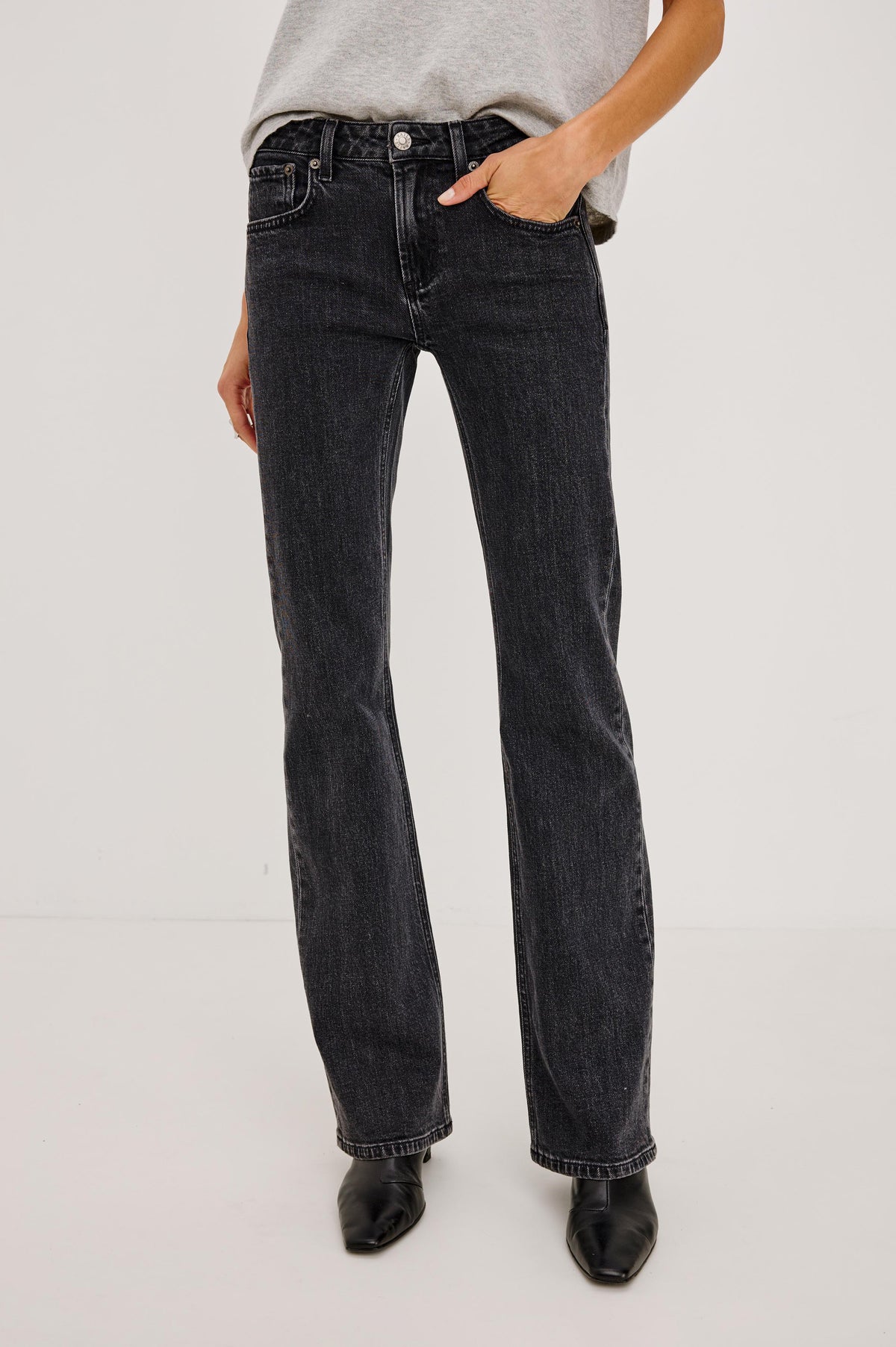 Fremont Low Rise Bootcut Jean in Light Stretch Denim With Extended Inseam, 5-Pockets, Belt Loops, and Zip-Fly Closure in Blackjack Colorway - Full Body Front View Featured on Model