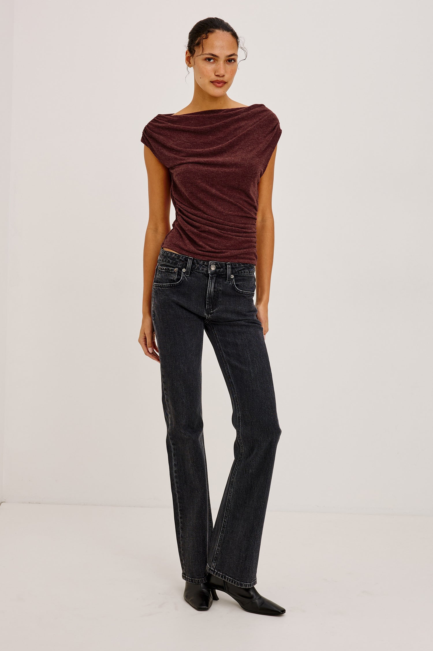 Fremont Petite Low Rise Bootcut Jean in Light Stretch Denim With Extended Inseam, 5-Pockets, Distressed Details, Belt Loops, and Zip-Fly Closure in Blackjack Colorway - Full Body Front View Featured on Model
