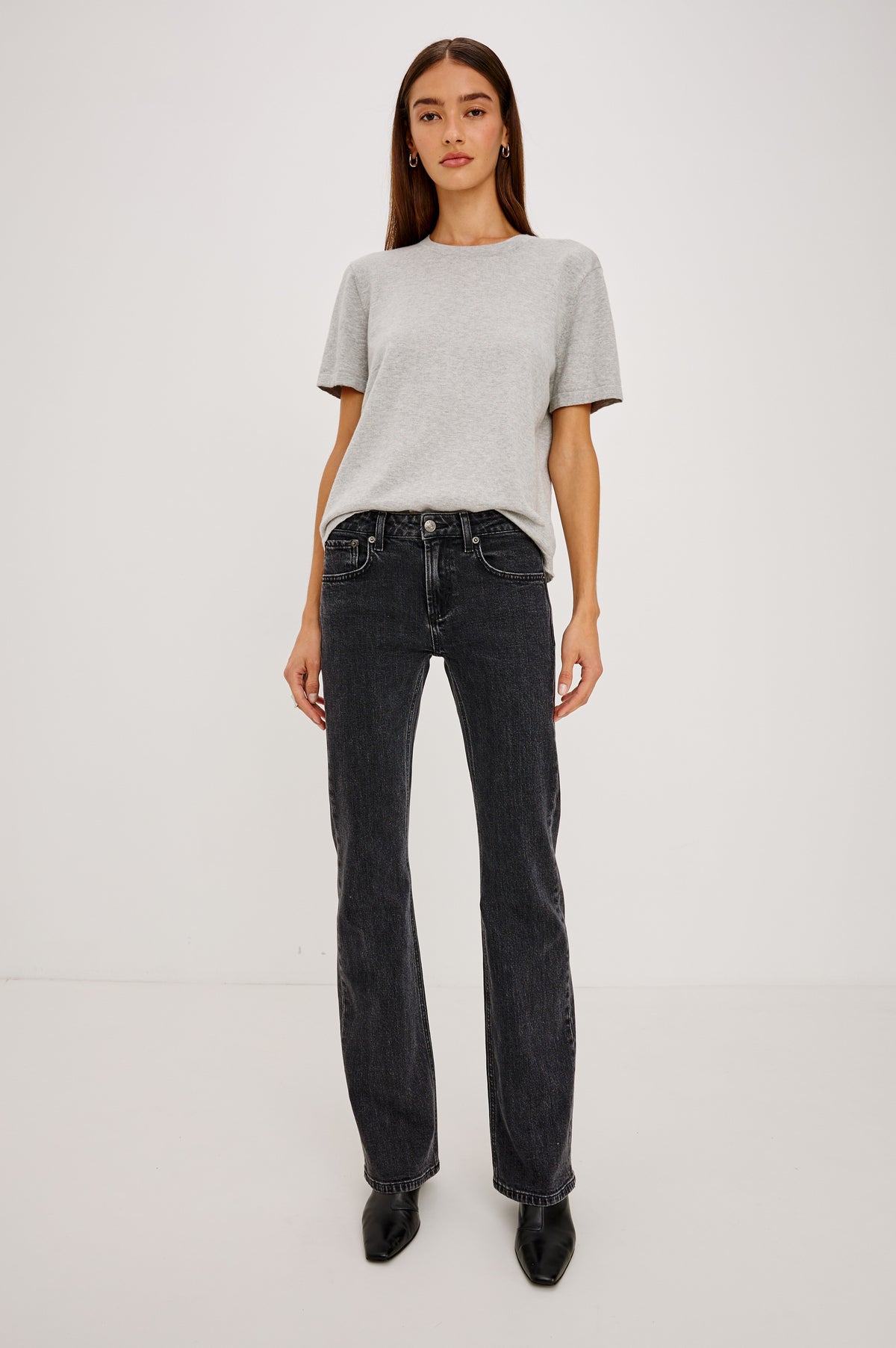 Fremont Petite Low Rise Bootcut Jean in Light Stretch Denim With Extended Inseam, 5-Pockets, Distressed Details, Belt Loops, and Zip-Fly Closure in Blackjack Colorway - Full Body Front View Featured on Model
