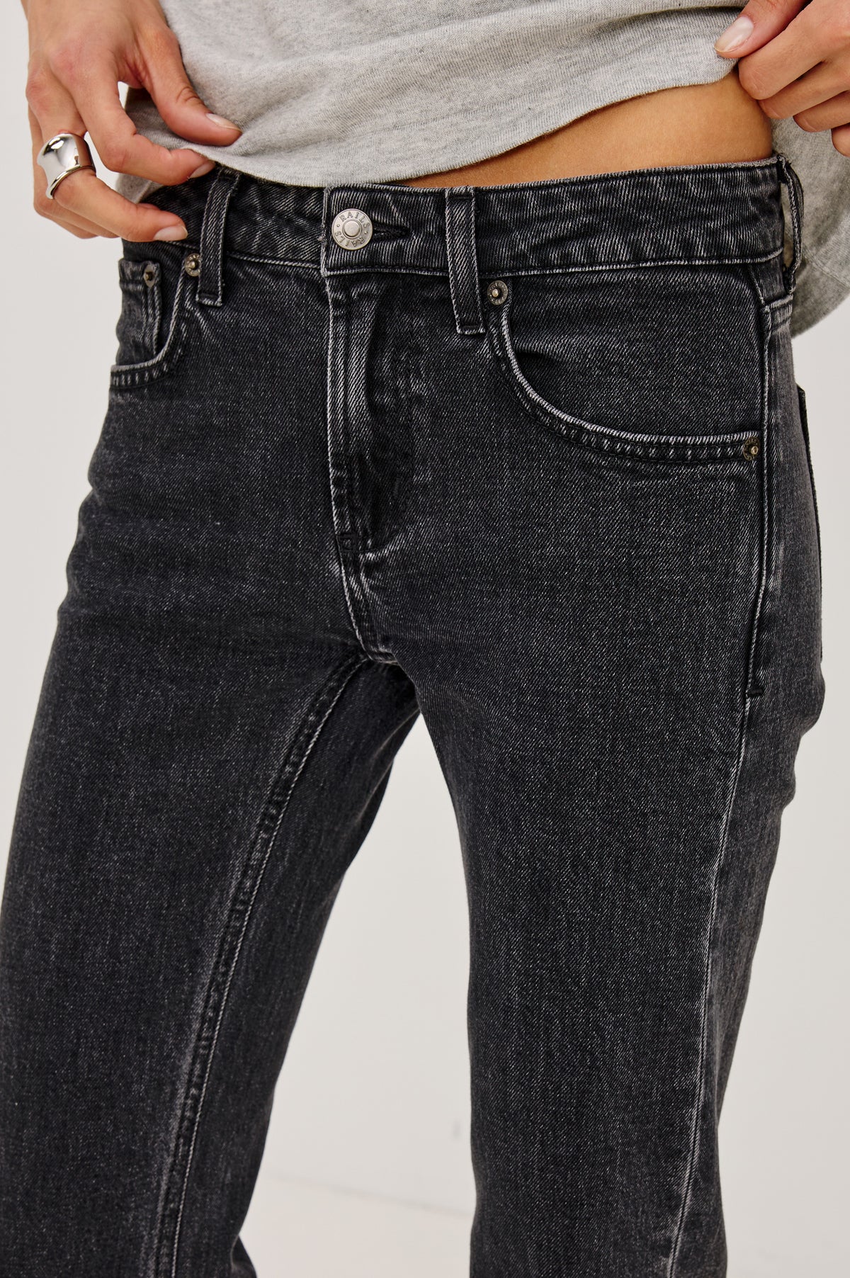 Fremont Petite Low Rise Bootcut Jean in Light Stretch Denim With Extended Inseam, 5-Pockets, Distressed Details, Belt Loops, and Zip-Fly Closure in Blackjack Colorway - Mid Body Front View Featured on Model