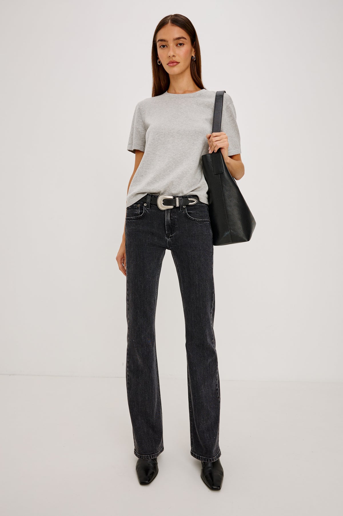 Fremont Petite Low Rise Bootcut Jean in Light Stretch Denim With Extended Inseam, 5-Pockets, Distressed Details, Belt Loops, and Zip-Fly Closure in Blackjack Colorway - Full Body Front View Featured on Model