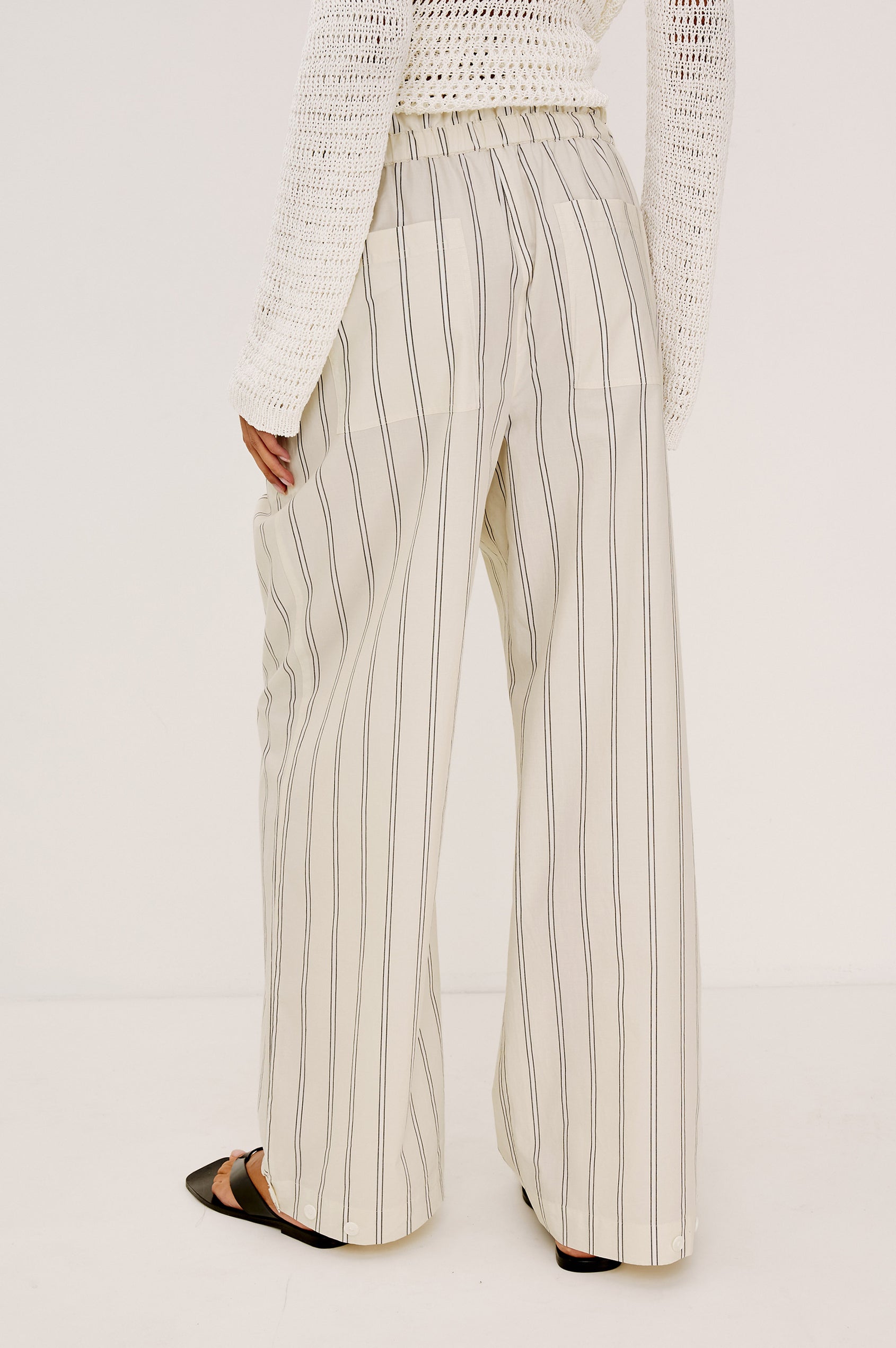 Fulham Pant in Cotton Poplin With Mid-Rise, Pleated Details, Zip Fly, and Back Pockets - Back Crop View Featured on Model