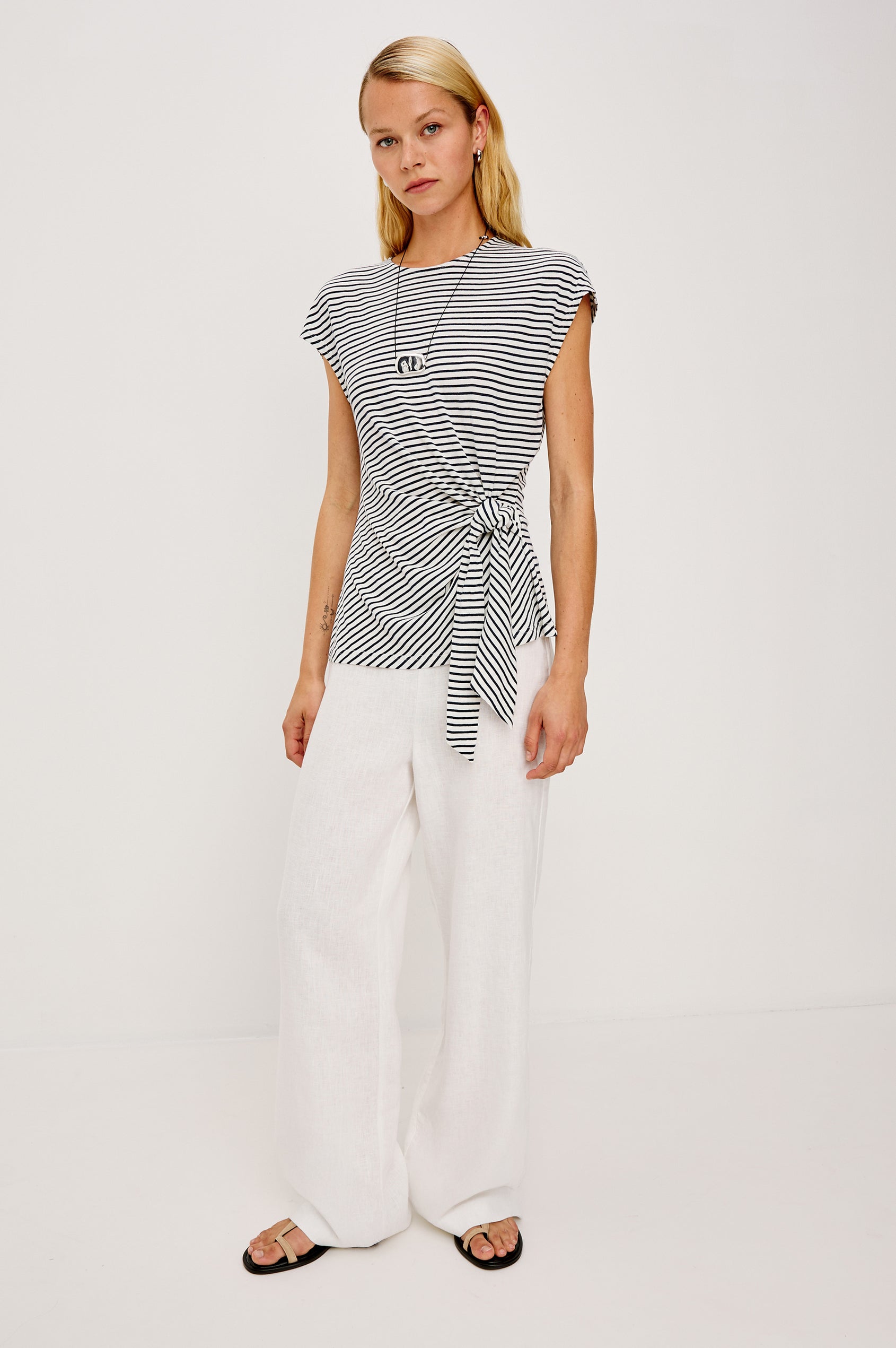 Gabbie Top in Cotton With Boat Neckline Dolman Cap Sleeves and Waist Wrap Ties in Ivory Navy Micro Stripe Colorway - Full Body Front View Featured on Model
