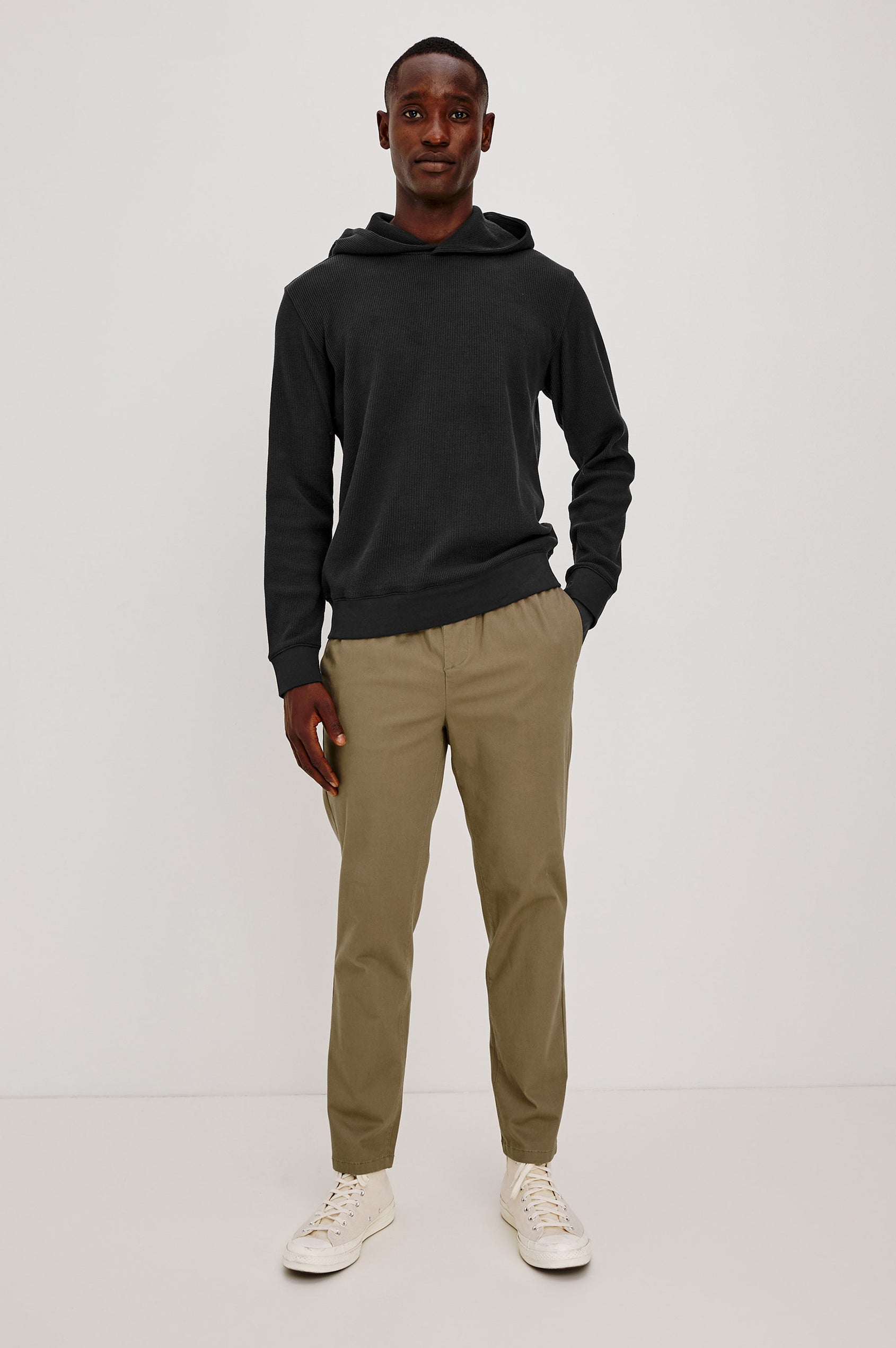 Gates Hoodie in Micro-Waffle Cotton Blend With Fixed Hood, Long Sleeves, and Relaxed Fit in Onyx Colorway - Full Body Front View Featured on Model