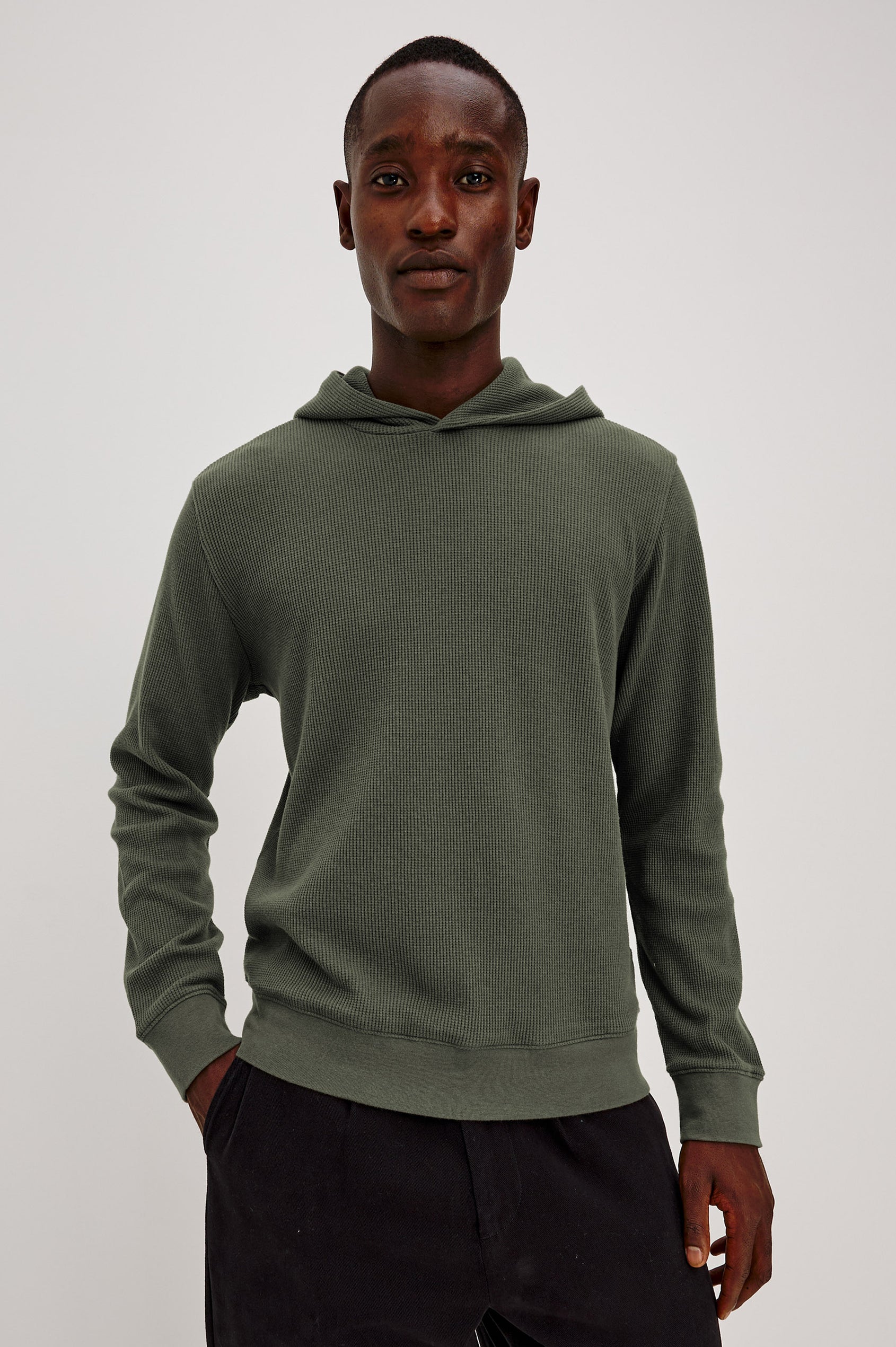 Gates Hoodie in Micro-Waffle Cotton Blend With Fixed Hood, Long Sleeves, and Relaxed Fit in Pine Needle Colorway - Upper Body Front View Featured on Model