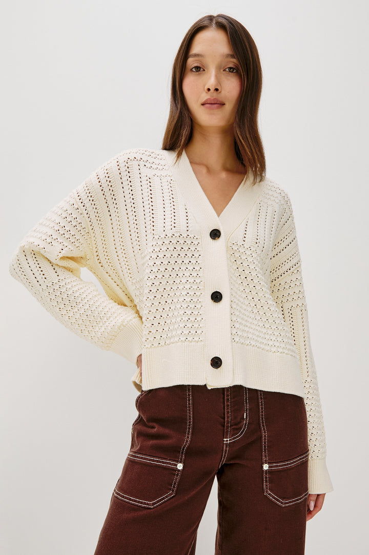 Geneva cropped cardigan sweater with front buttons and pointelle details in Ivory Patchwork Pointelle Colorway - Front View Featured on Model