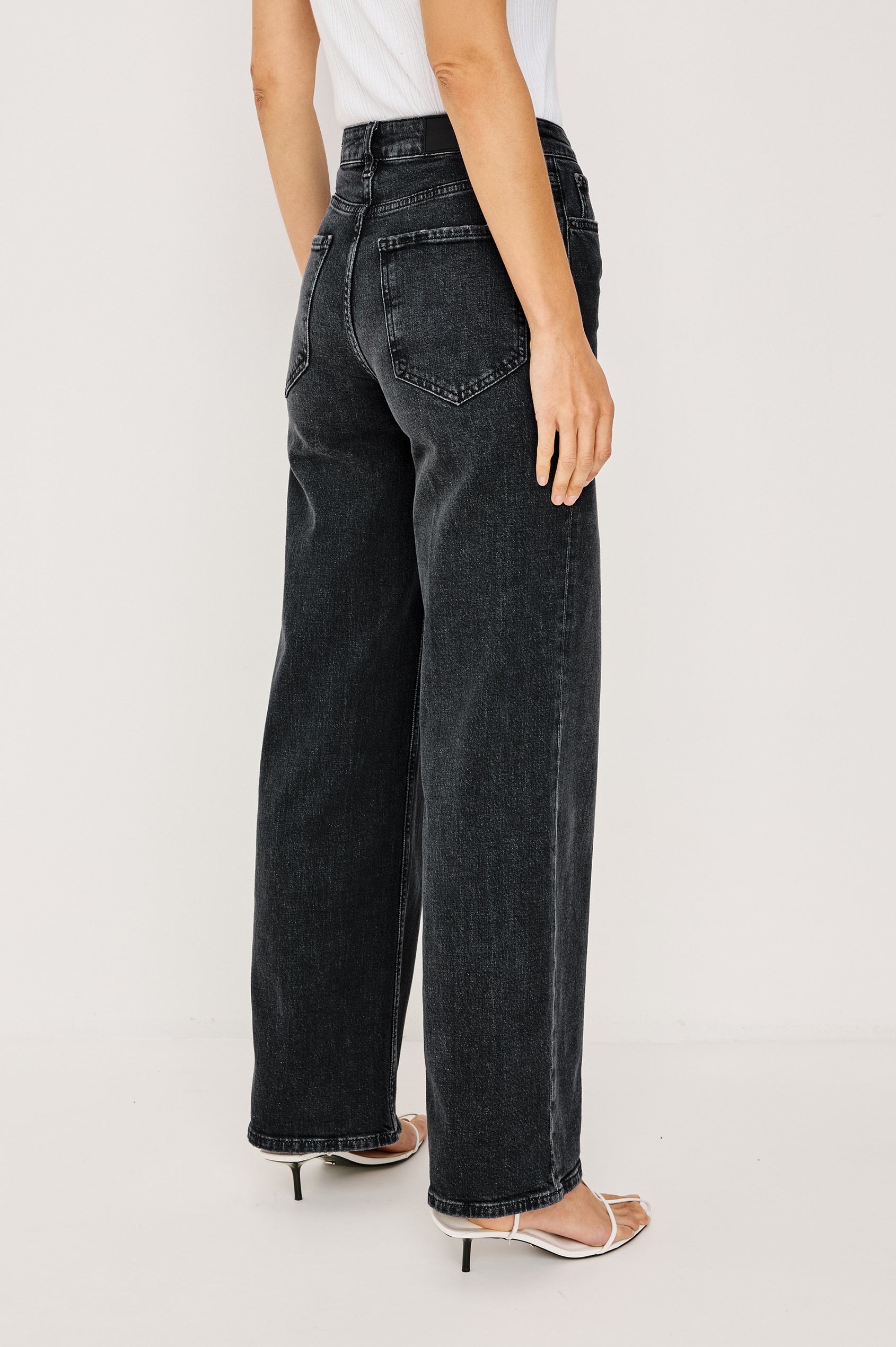 Getty Wide Leg Jean in Dark Wash Denim With High-Rise High-Waisted Fit, Front Button Fly, 5-Pocket Styling in Black Pearl Colorway - Lower Body Back View Featured on Model