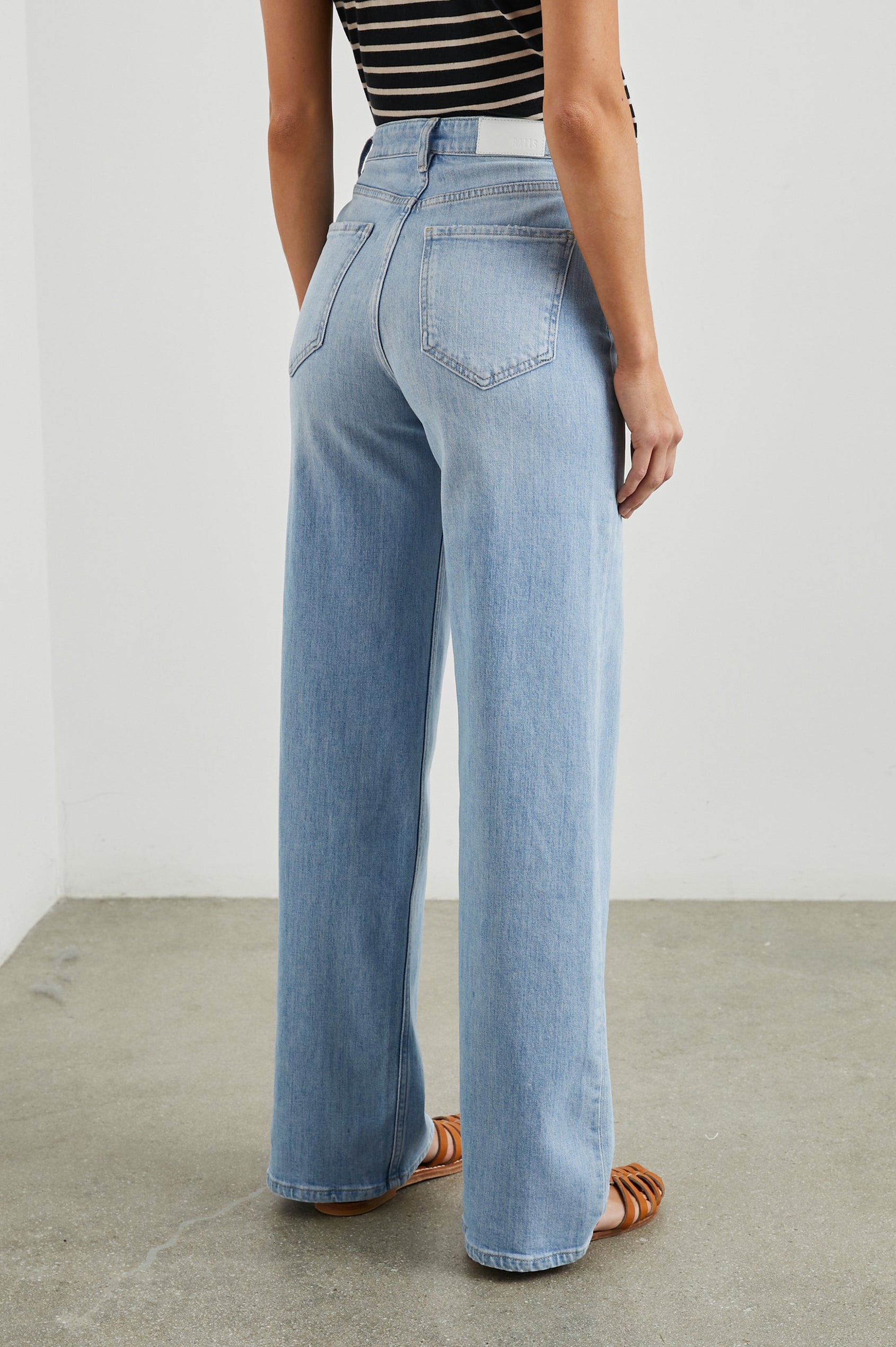 Getty Wide Leg Denim Pants with Belt Loops, Two Front Pockets and Two Back Patch Pockets in Blue Mist Colorway - Back View Featured on Model