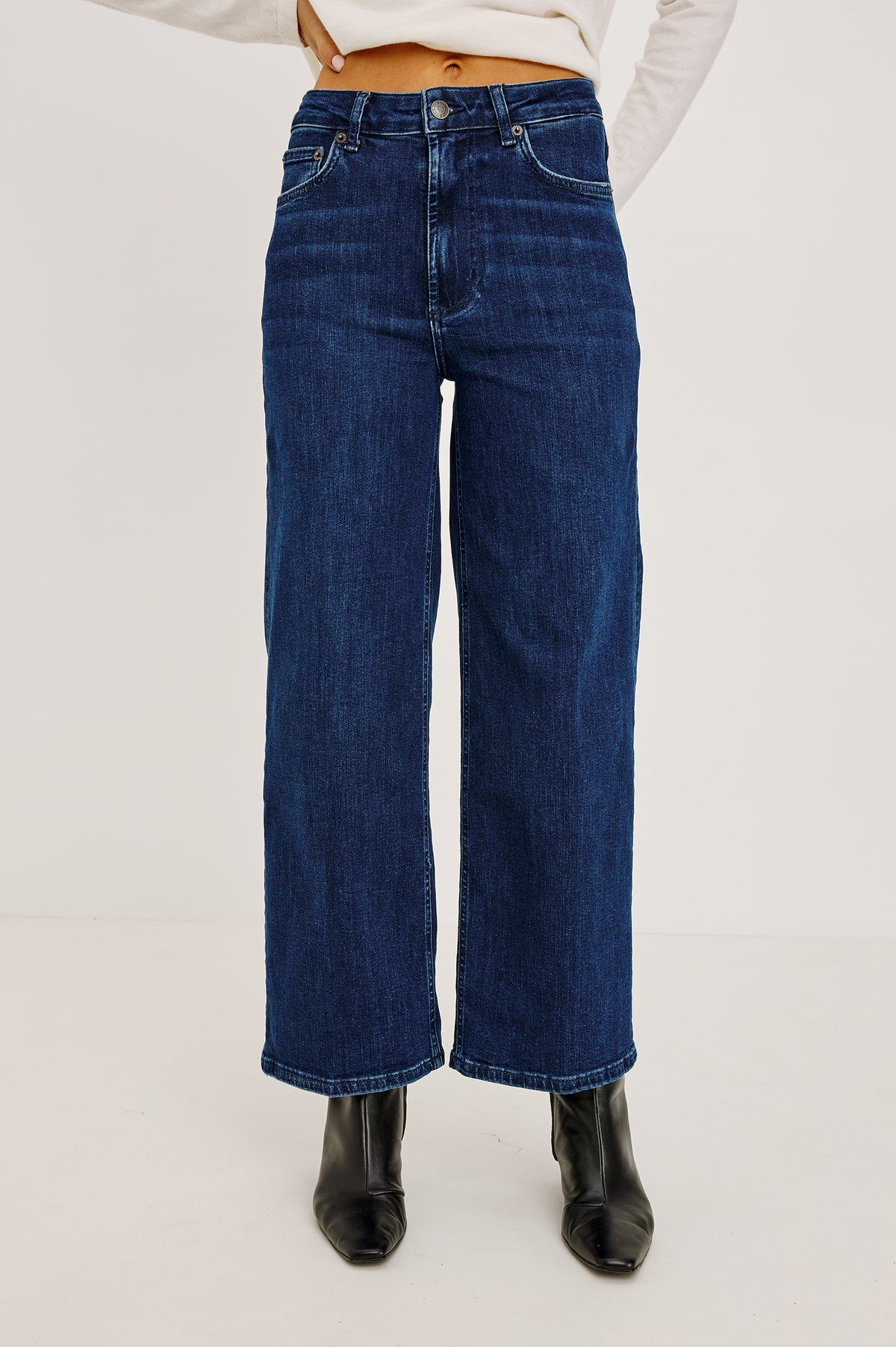 Getty Crop Wide Leg Jean in Light Stretch Denim With High-Rise High-Waisted Fit, Button Fly, and 5-Pockets in After Midnight Colorway - Front View Featured on Model.