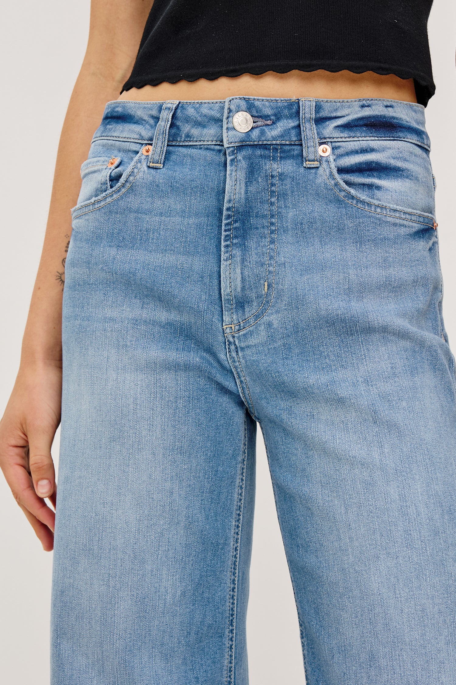 Getty Crop Jean in Light Stretch Denim With Wide Straight Legs, 27″ Inseam, Floral Embroidery, 5-Pockets, and Zip Fly in Independence Colorway - Lower Body Back View Featured on Model