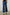Getty Crop Wide Leg Denim Pants with Belt Loops, Two Front Pockets and Two Back Patch Pockets in Indigo Patchwork Colorway, with large patches in blues - Back View Featured on Model