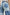 Getty Crop Wide Leg Denim Pants with Belt Loops, Two Front Pockets and Two Back Patch Pockets in Light Indigo Patchwork Colorway, with large patches in blues - Back View Featured on Model