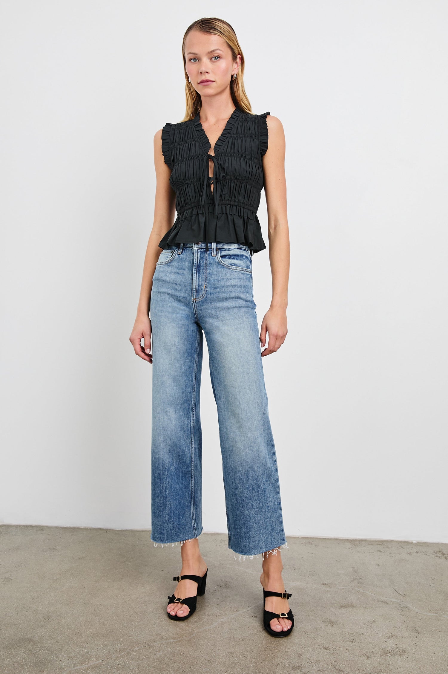 Getty cropped 5-pocket wide leg jean with in Tradewind, a medium wash. Front full body view featured on model.