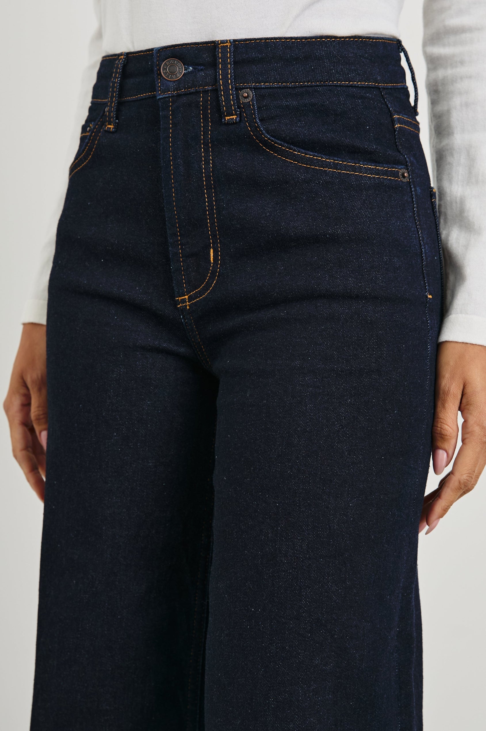 Getty Wide Leg Denim Pants with Cuffed Hems, Belt Loops, Two Front Pockets and Two Back Patch Pockets in Midnight Blues Cuffed Colorway - Front View Featured on Model