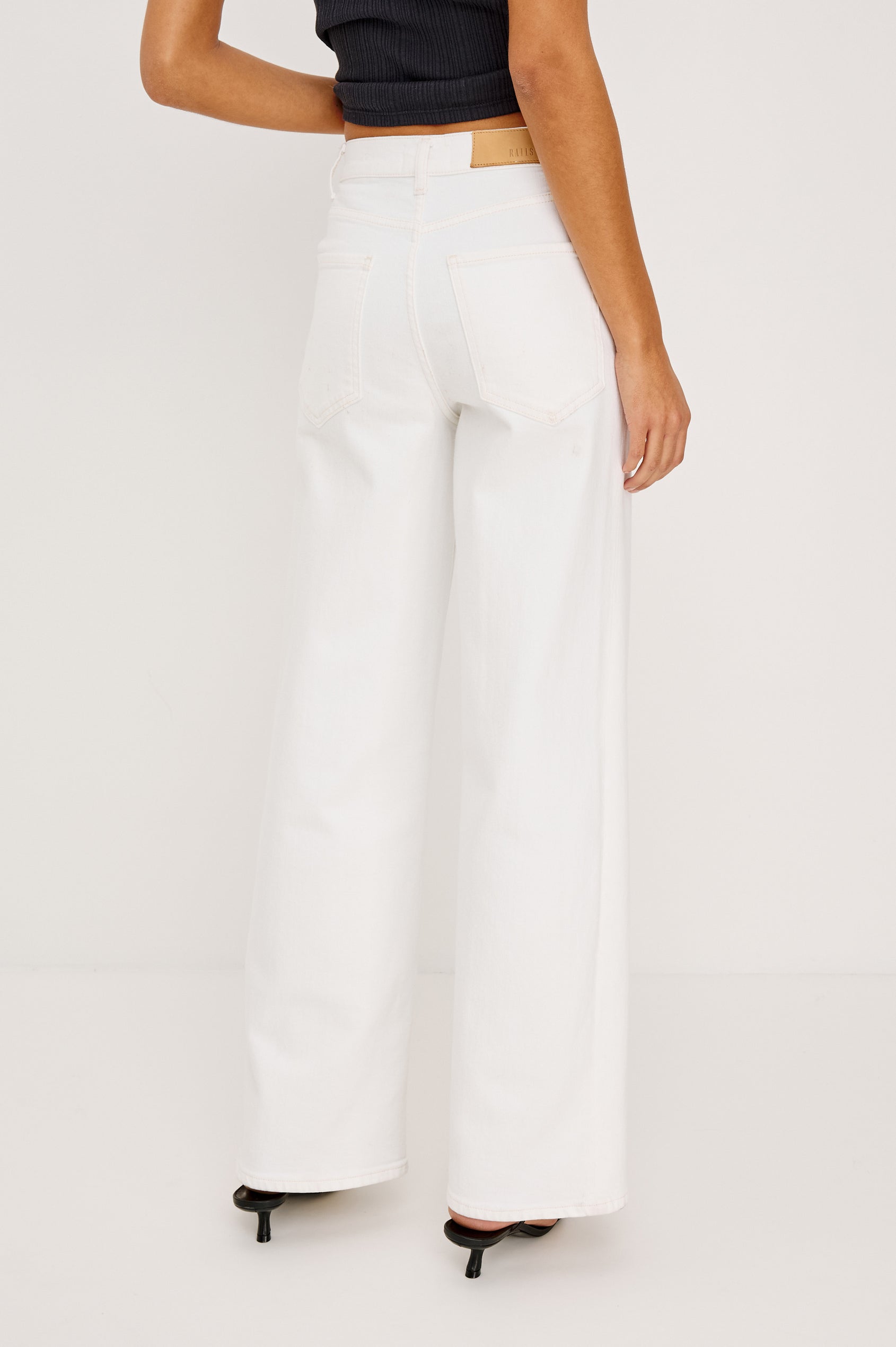 Getty Petite Wide Leg Jean in Light Stretch Denim With High Rise, 5-Pockets, and Button Fly in Vintage Ecru - Lower Body Back View Featured on Model