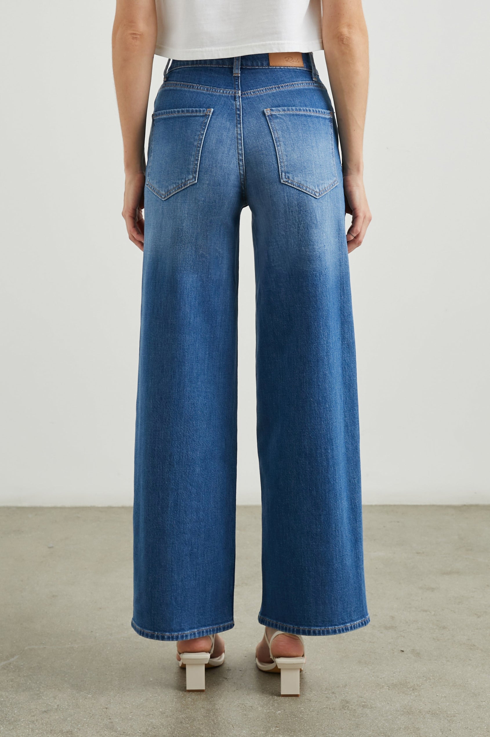 Getty Wide Leg Denim Pants with Belt Loops, Two Front Pockets and Two Back Patch Pockets in Tidal Wave Colorway - Back View Featured on Model
