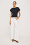 Getty Wide Leg Jean in Light Stretch Denim With High-Rise High-Waisted Fit, Button Fly, and 5-Pocket Styling in Vintage Ecru Colorway - Full Body Front View Featured on Model