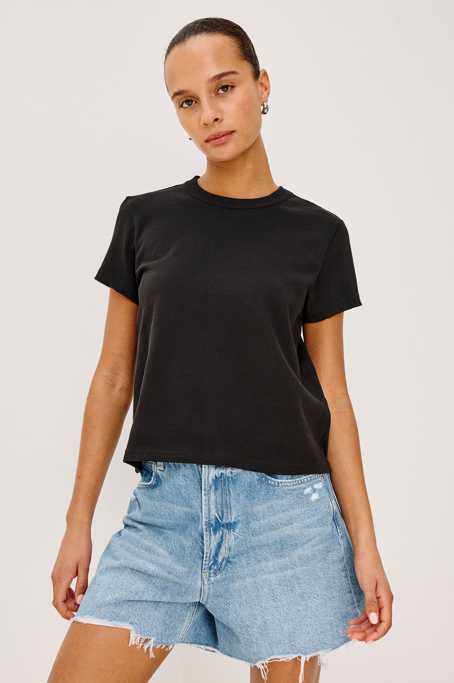 Girlfriend T-Shirt in Pleated Jersey With Slightly Boxy, Cropped Silhouette in Black Colorway - Upper Body Front View Featured on Model