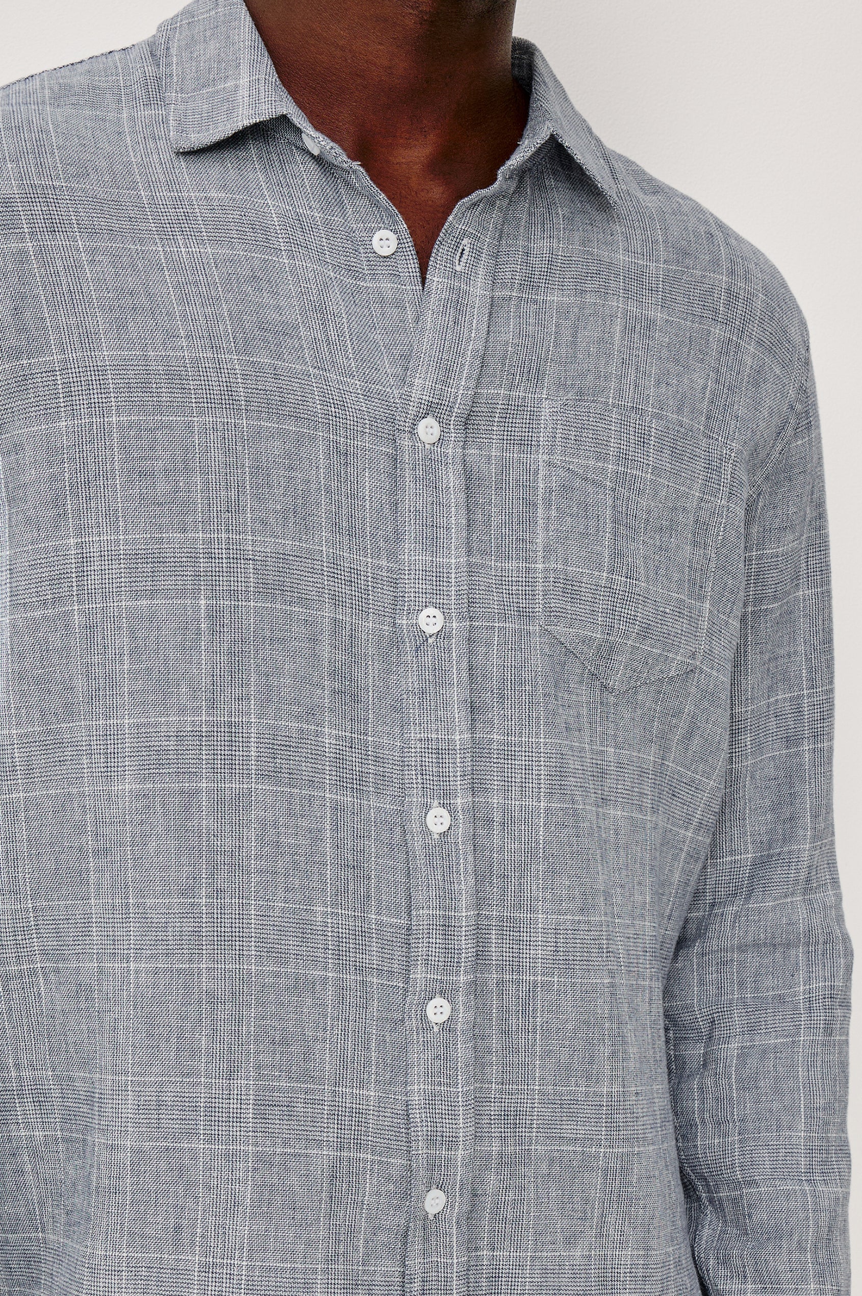 Gracy Collared Button Front Shirt in Linen Cotton Blend With Chest Patch Pocket and Long Sleeves in Navy White Colorway - Upper Body Front Close Up View Featured on Model