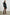 Harmony Long-Sleeve Mini Dress with Buttons Down the Front, Buttoned Cuffs, a Collar, Side Slits and a Tie at the Waist in Black Colorway - Front Full Body View Featured on Model