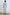Harmony Long-Sleeve Mini Dress with Buttons Down the Front, Buttoned Cuffs, a Collar, Side Slits and a Tie at the Waist in Oxford White Stripe Colorway, Vertical Blue and White Stripes - Back Full Body View Featured on Model