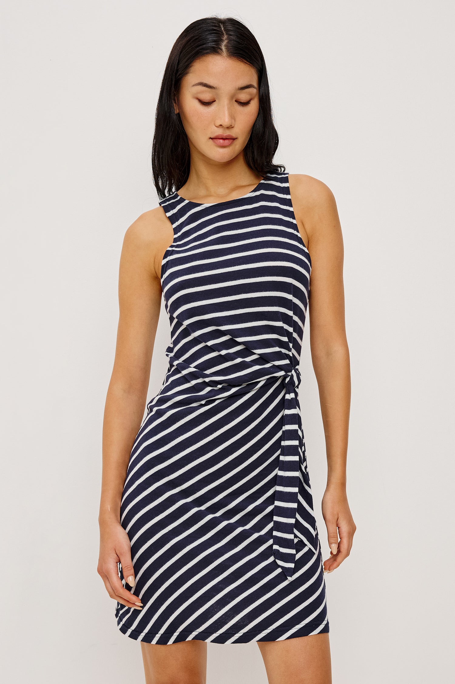 Harriet Mini Dress in Cotton With HIgh Neckline Waist Wrap Ties and A-Line SKirt in Navy Ivory Stripe Colorway - Full Body Front View Featured on Model