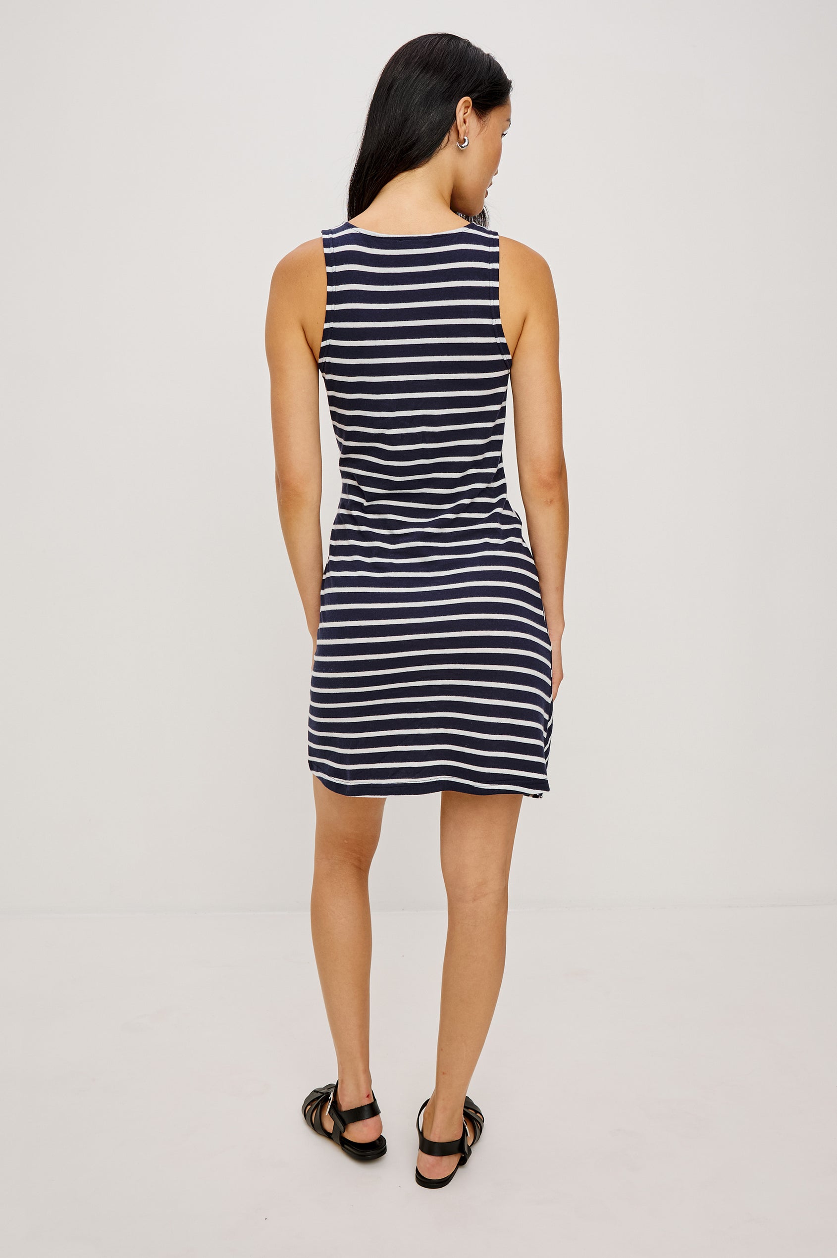 Harriet Mini Dress in Cotton With HIgh Neckline Waist Wrap Ties and A-Line SKirt in Navy Ivory Stripe Colorway - Full Body Back View Featured on Model