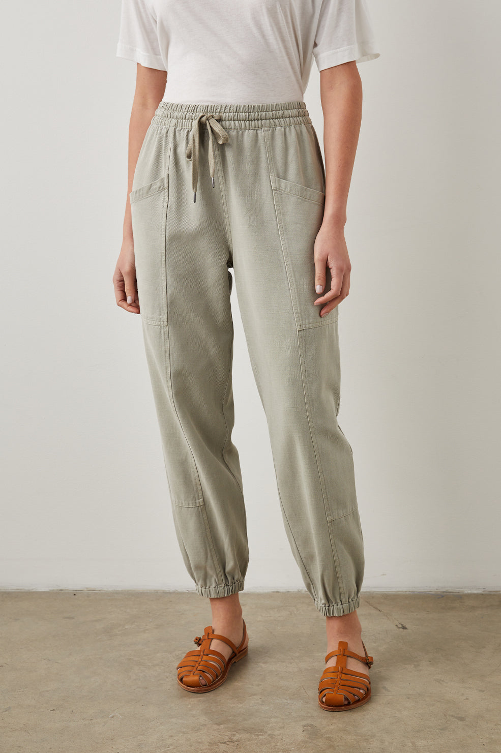 Haven Pants with a Drawstring Waist, Front Seams, Elasticized Hems, Two Front Pockets and Two Back Welt Pockets in Sage Colorway - Front View Featured on Model 