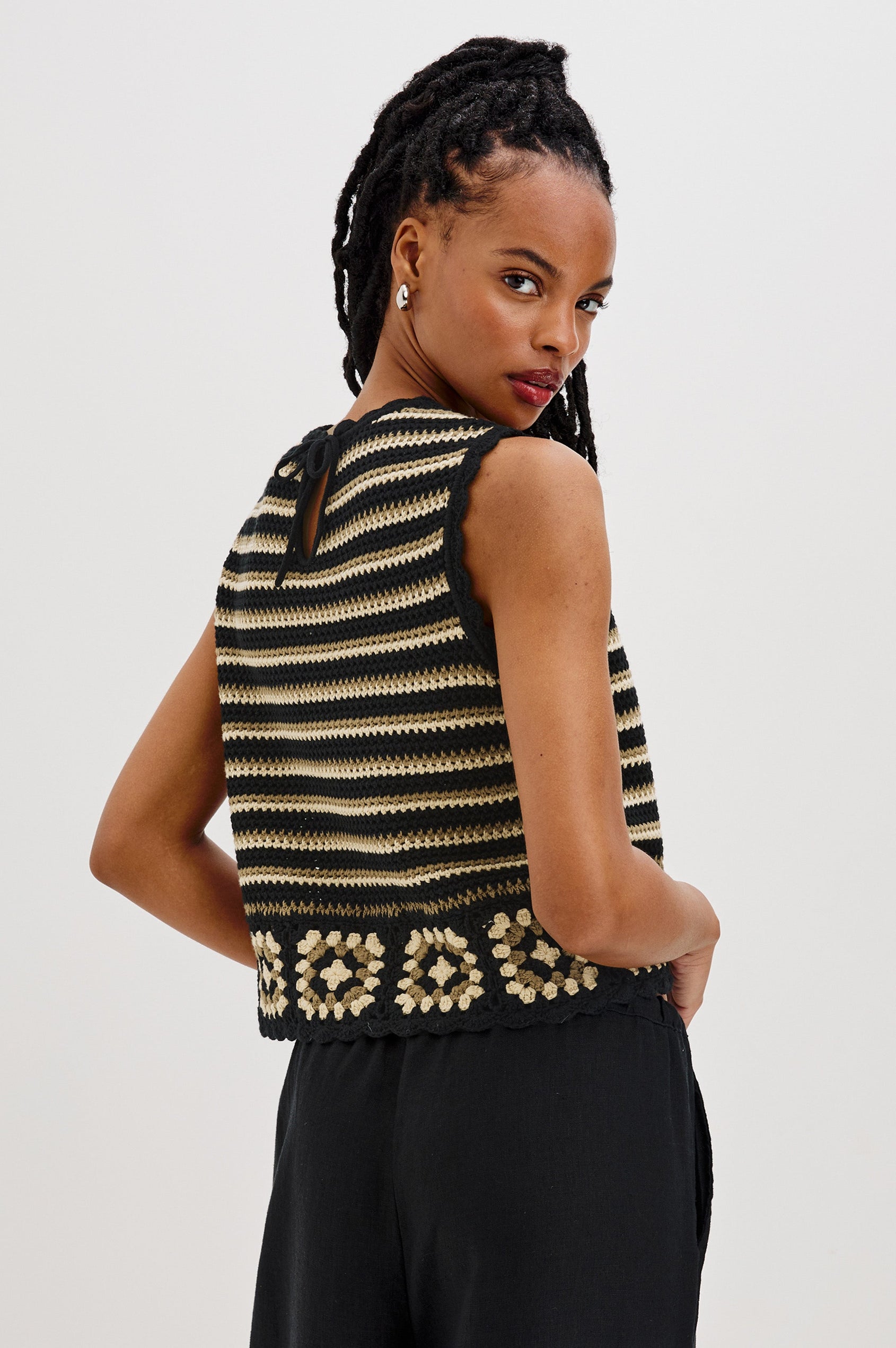 Hazel Crew Neck Crochet Top with Scalloped Hem, Sleeveless in Black and Gold Milos Colorway. Back View Shown on Model.