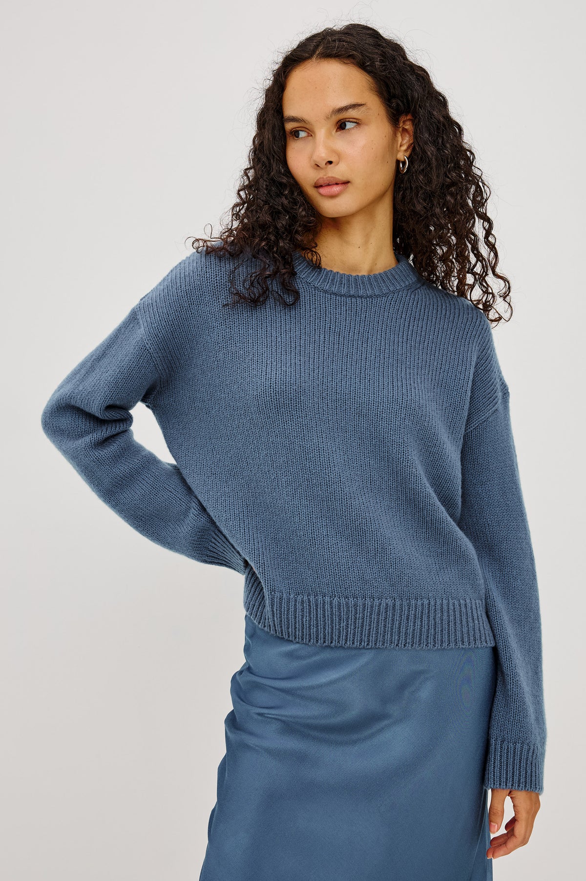 Helly Sweater in Wool-Cashmere Blend With Crew Neckline, Relaxed Boxy Slightly Cropped Fit, Long Sleeves, and Ribbed Trim in Atlantic Colorway - Upper Body Front View Featured on Model