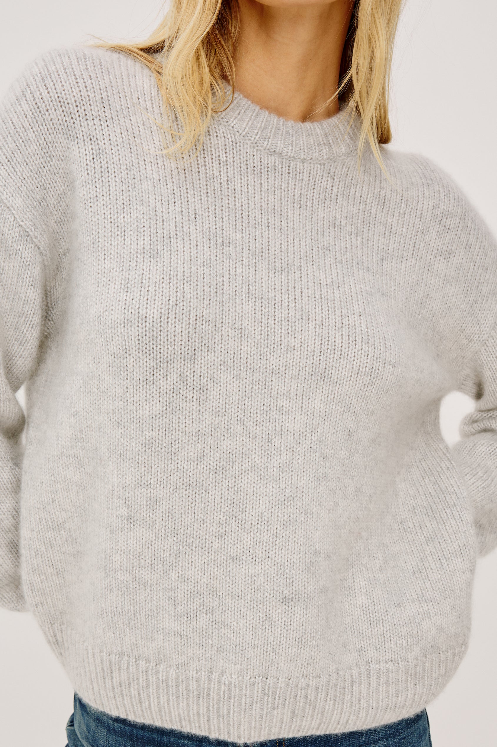 Helly Sweater in Wool-Cashmere Blend With Crew Neckline, Relaxed Boxy Slightly Cropped Fit, Long Sleeves, and Ribbed Trim in Heather Grey Colorway - Upper Body Front View Featured on Model