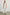 Henrik Pants with a Shirred Waist, Two Front Pockets and an Eyelet Design at the Hems in White Colorway - Front Full Body View Featured on Model 