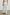 Henrik Pants with a Shirred Waist, Two Front Pockets and an Eyelet Design at the Hems in White Colorway - Back View Featured on Model 