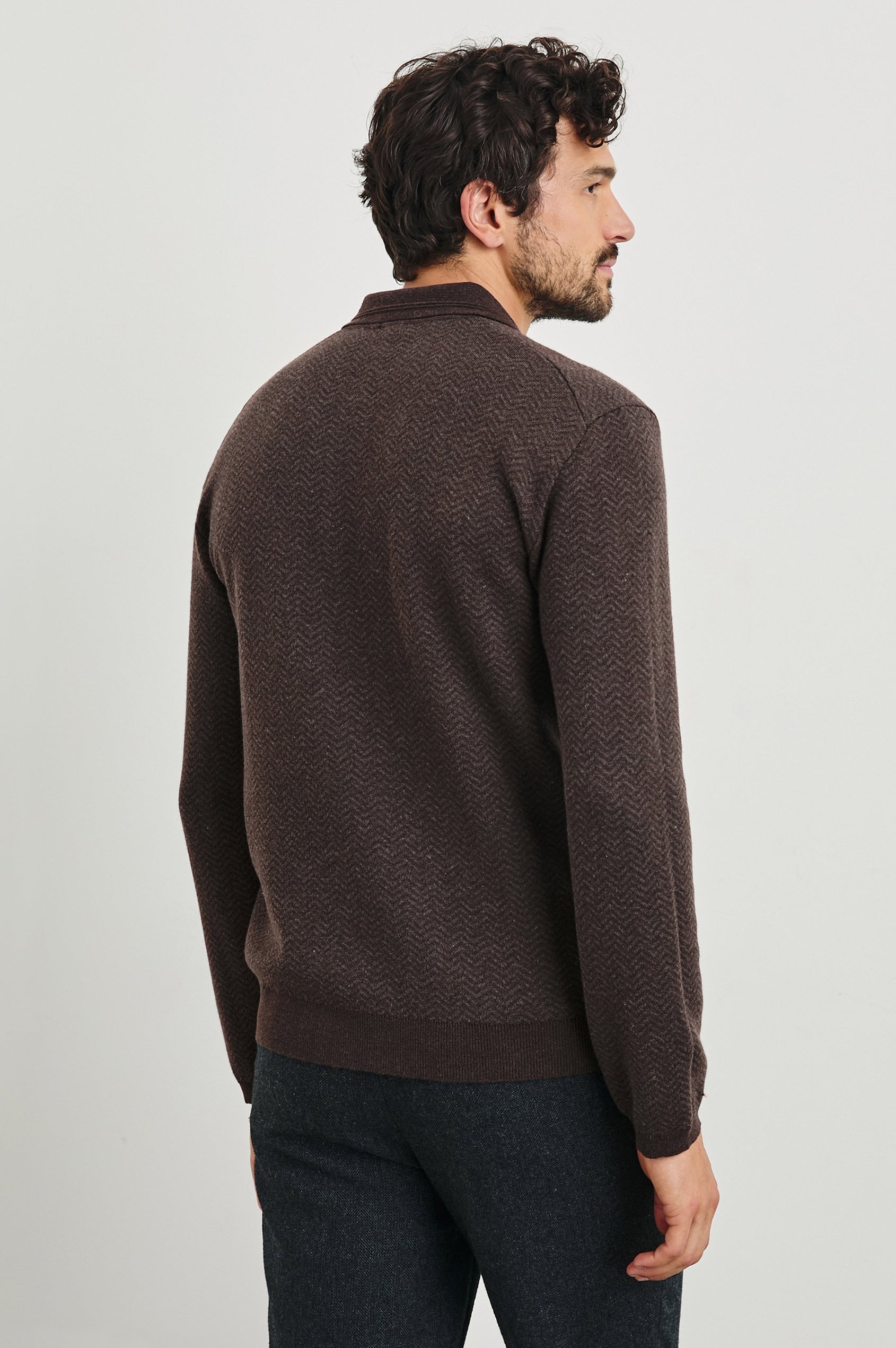 Herrington Long-Sleeve Collared Sweater with a Two Button Placket and a Herringbone Jacquard in Brown Herringbone Melange Colorway - Back View Featured on Model