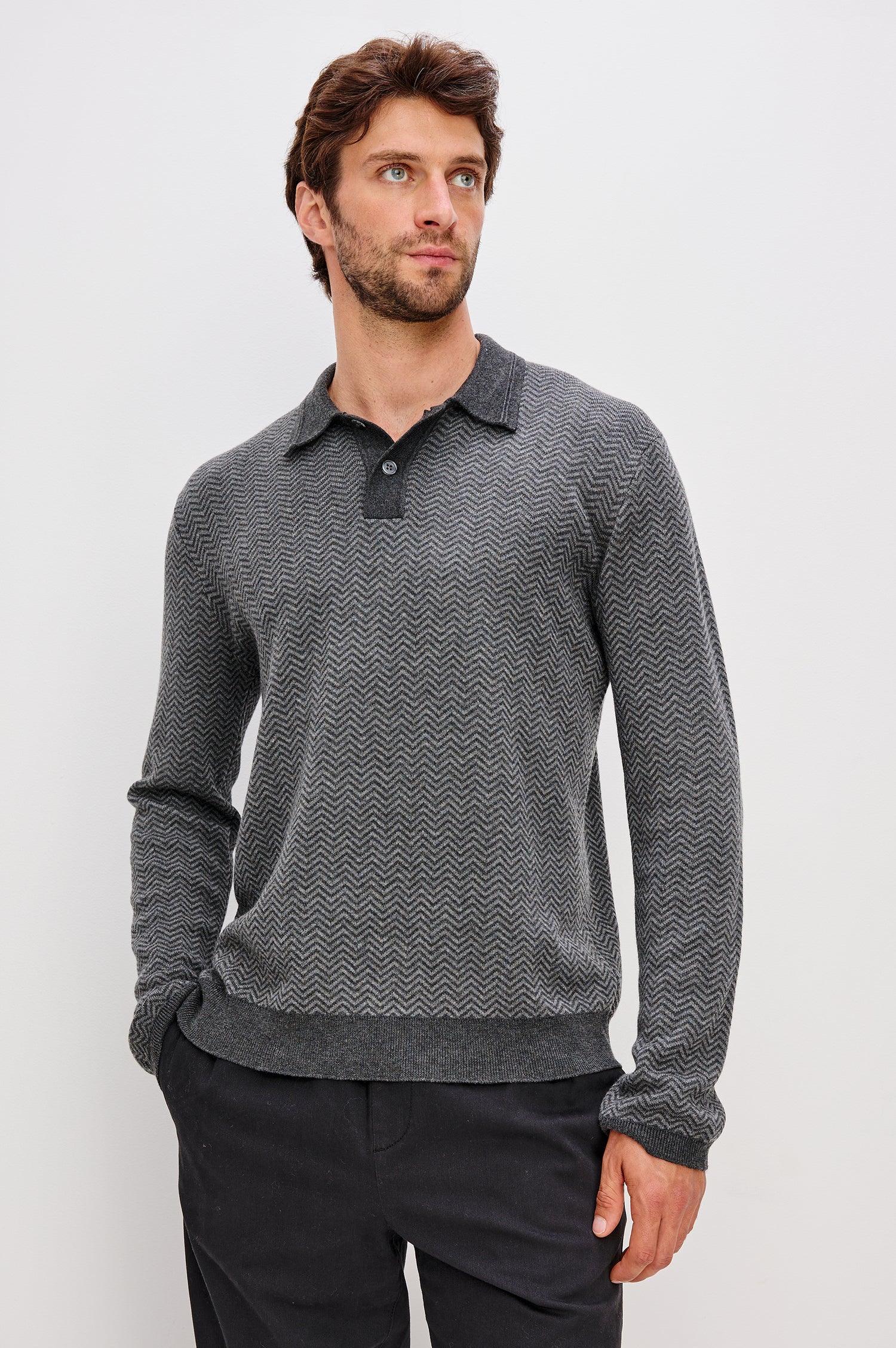 Herrington Long-Sleeve Collared Sweater with a Two Button Placket and a Herringbone Jacquard in Charcoal Herringbone Melange Colorway. Front View Featured on Model.