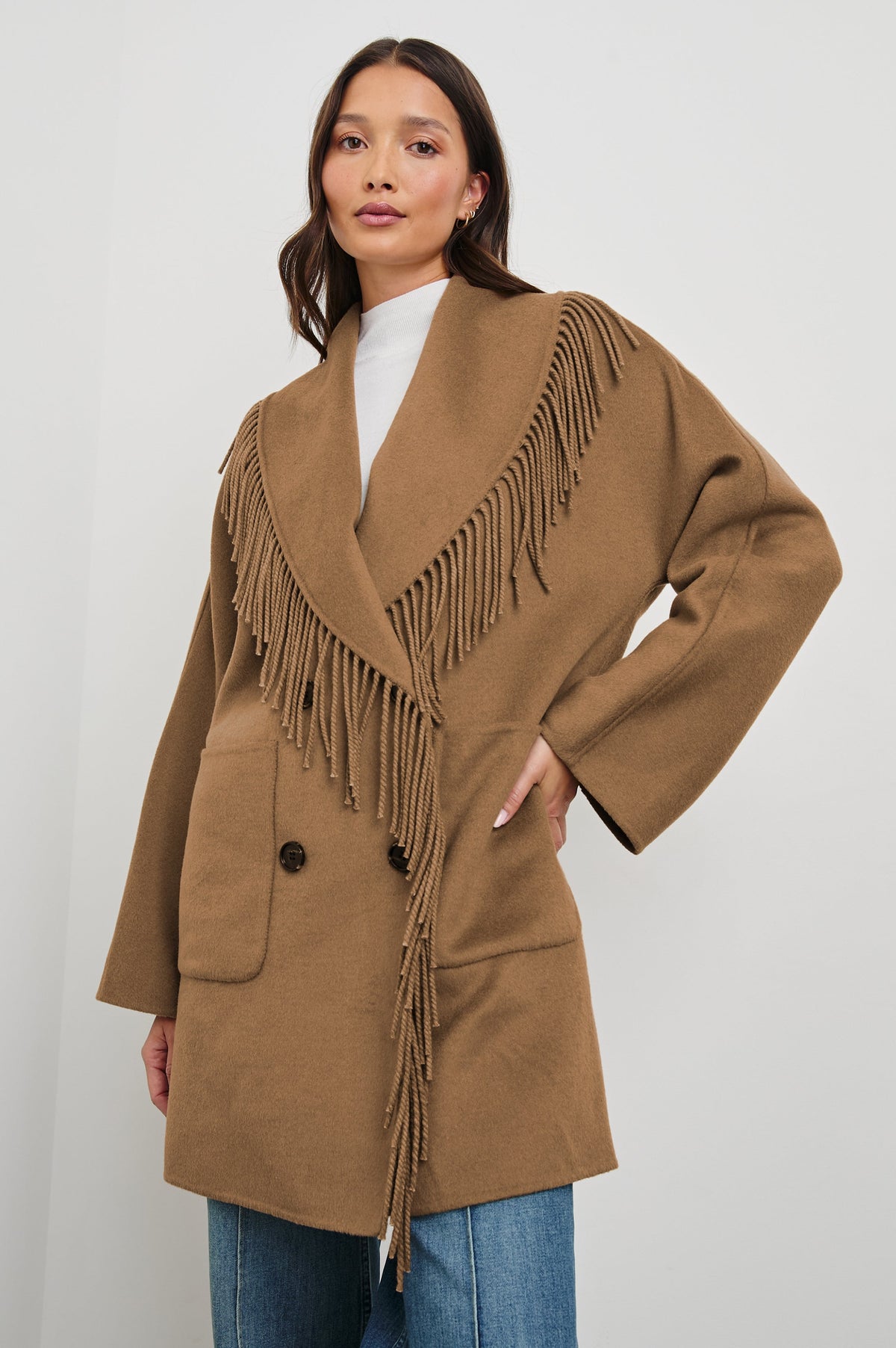 Hugo Double-Breasted, Mid-Thigh Length Coat with Button Closure, Wide Lapels, Two Front Patch Pockets and Fringe along the Lapels and Closure in Camel Colorway - Front View Featured on Model 