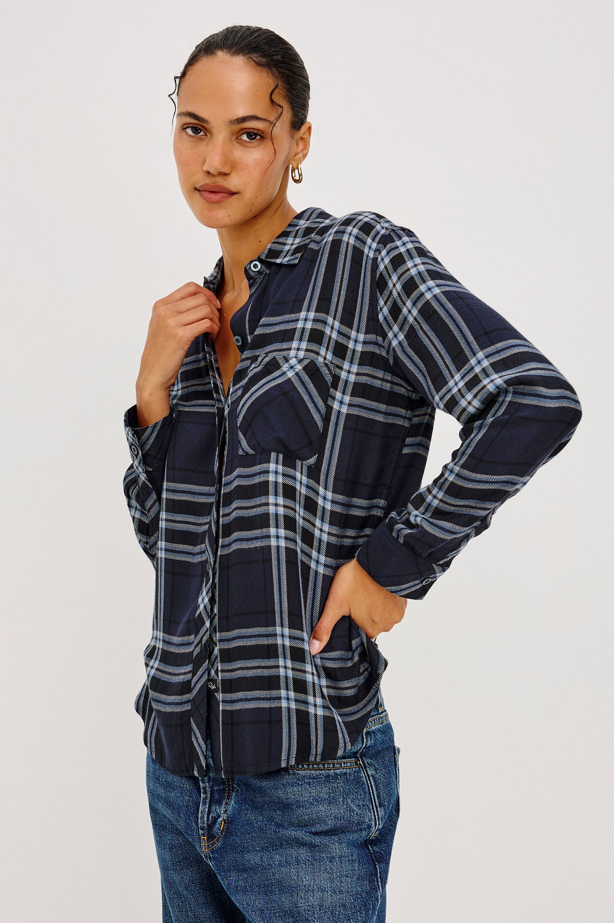 Hunter Shirt Plaid Button-Up With Relaxed Fit, Spread Collar, Chest Pocket, Long Sleeves, and Curved Hem in Indigo Sky Colorway - Front Crop View Featured on Model.