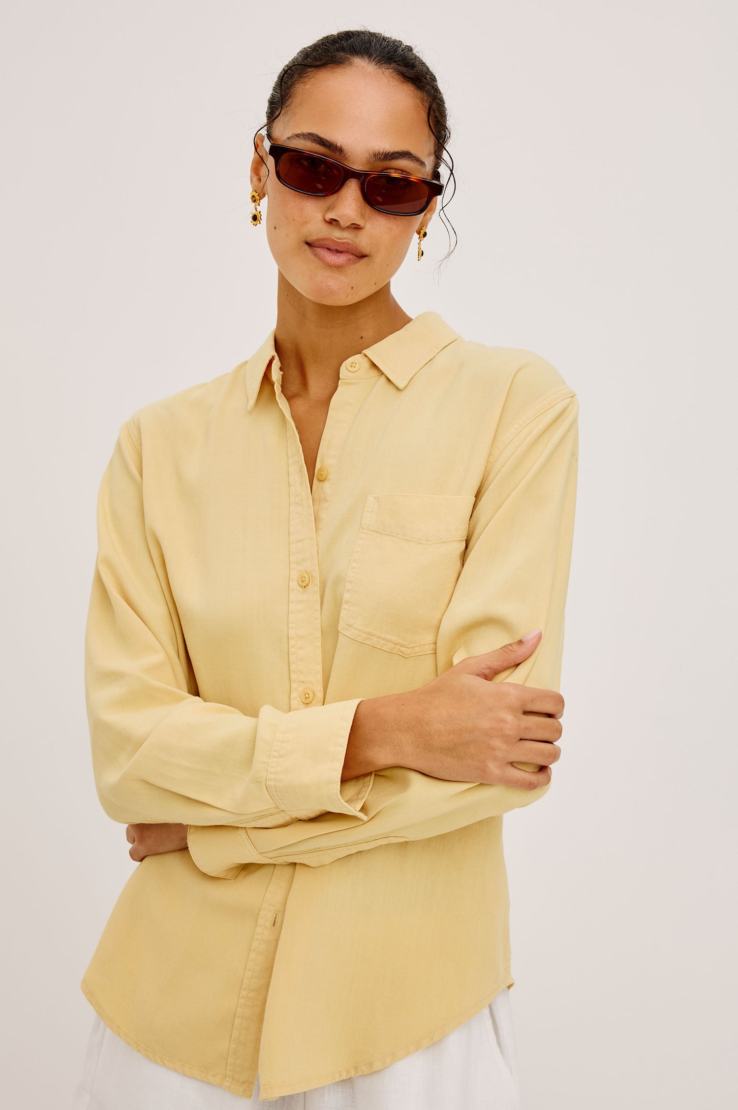 Ingrid Button-Up Shirt in TENCEL™Denim With Collar, Chest Patch Pocket, and Long Sleeves in Italian Straw Colorway - Upper Body Front View Featured on Model