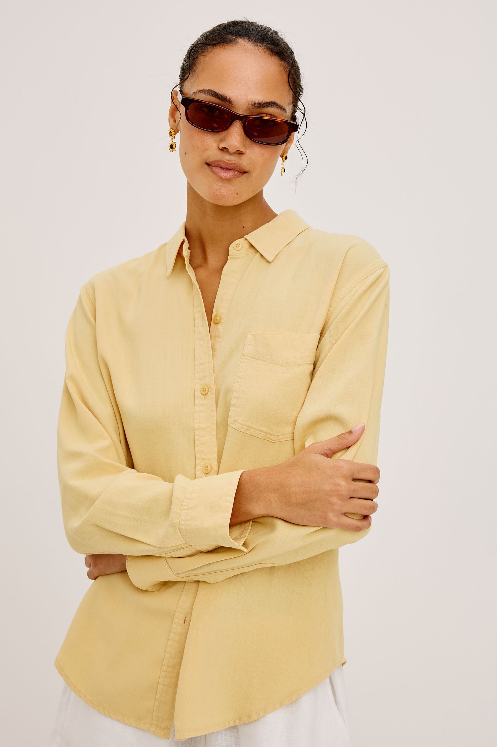 Ingrid Button-Up Shirt in TENCEL™Denim With Collar, Chest Patch Pocket, and Long Sleeves in Italian Straw Colorway - Upper Body Front View Featured on Model
