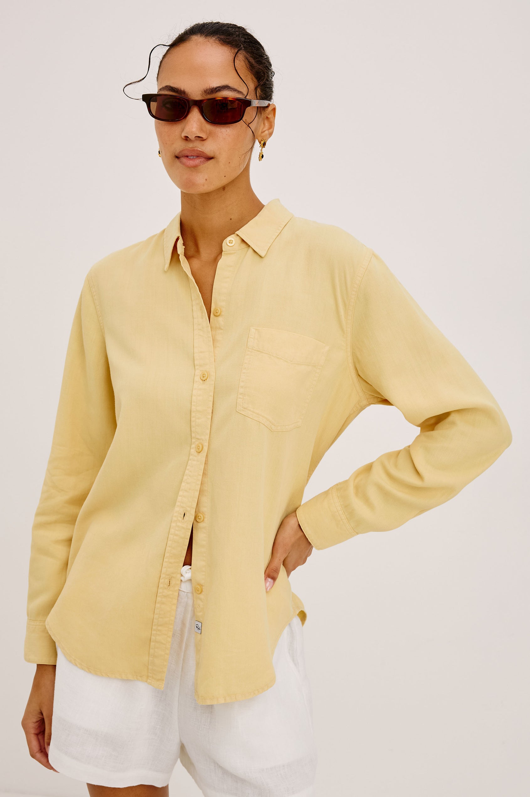 Ingrid Button-Up Shirt in TENCEL™Denim With Collar, Chest Patch Pocket, and Long Sleeves in Italian Straw Colorway - Upper Body Front View Featured on Model