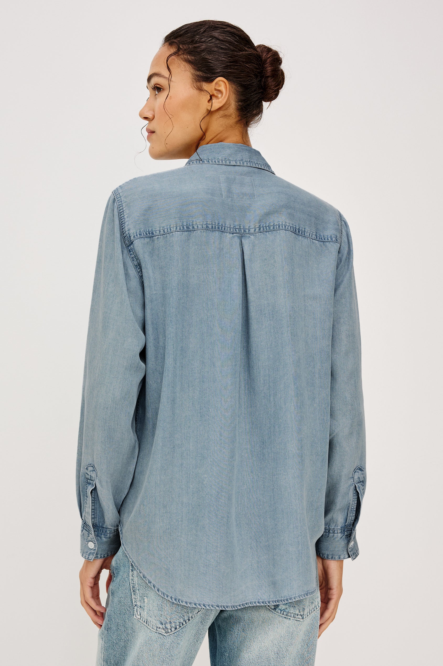 Ingrid Button-Up Collared Shirt in TENCEL™Denim With Vintage-Inspired Wash, Chest Patch Pocket, and Long Sleeves in Cloud Wash Colorway - Upper Body Back View Featured on Model