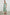 Iona Short Sleeve Midi Dress with Flutter Sleeves, a Deep V Neck with Ties, and a Shirred Waist in Seaview Stripe Colorway, Vertical Stripes in Browns, Blues and Creams - Front Full Body View Featured on Model 