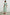 Iona Short Sleeve Midi Dress with Flutter Sleeves, a Deep V Neck with Ties, and a Shirred Waist in Seaview Stripe Colorway, Vertical Stripes in Browns, Blues and Creams - Back Full Body View Featured on Model 