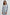 Irie Long-Sleeve Midi Dress with an Overlapped V Neck, Buttons Down the Skirt, a Side Thigh Slit, a Collar and a Seam at the Waist in Hampton Stripe Colorway, Black and White Diagonal and Vertical Stripes on Light Blue - Front View Featured on Model 