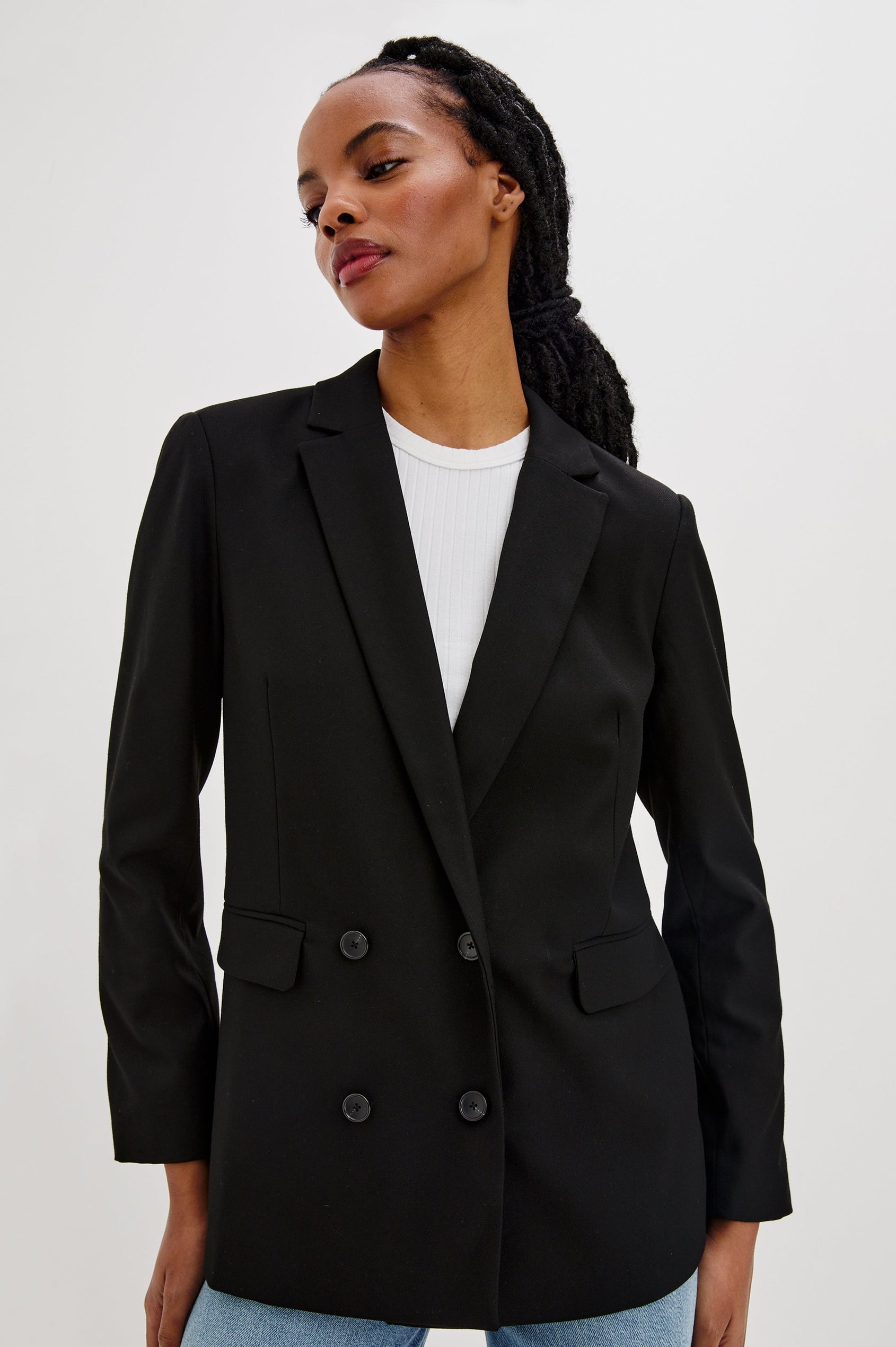 Jac Double-Breasted Blazer with Two Front Flap Pockets and a Notched Label in Black Twill Colorway - Front View Featured on Model