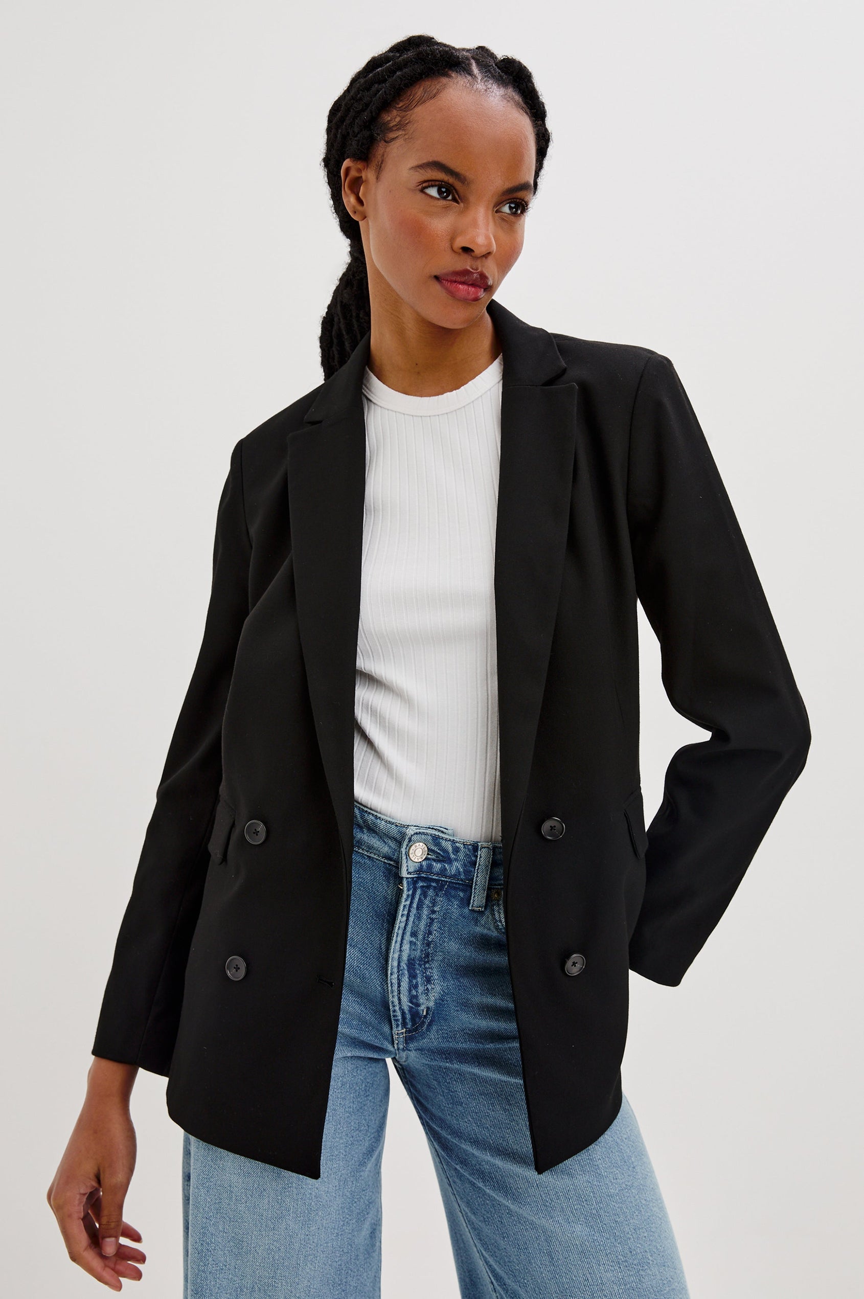 Jac Double-Breasted Blazer with Two Front Flap Pockets and a Notched Label in Black Twill Colorway - Front View Featured on Model